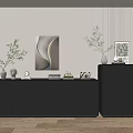 Modern Entryway Dark Console Table And Side Cabinet With Vases Plants And Artwork
