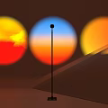 Decorative Floor Lamp With Black Pole And Three Circular Sunset Color Projections