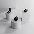 Modern Black Downlights and Spotlights on White Display Bases with Warm Lighting