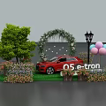 Red 05 e-tron Car Display with Flower Arch Green Grass Trees Balloons and Street Lamp