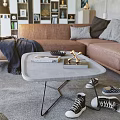 Modern Living Room Interior With Large Windows Gray Walls Bookshelf Brown Sofa And Coffee Table