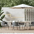 Modern Outdoor Wooden Table With Gray Chairs Umbrella And Green Plants