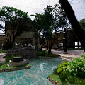 Commercial Landscape Design Featuring Modern Buildings Lush Greenery Water Pond And Stone Paths