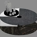 Modern Coffee Table with Textured Silver Top and Decorative Tray Holding Green Plant Books