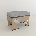Modern Wooden Stool With Gray Padded Seat And Unique Carved Legs