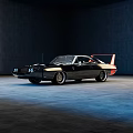 Classic Black Muscle Car Side Rear View with Red Spoiler and Vintage Styling