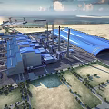 Industrial Plant With Large Blue Roof Structure Surrounding Roads Green Belts And Facilities