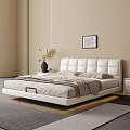 Modern White Double Bed with Upholstered Headboard in Beige Bedroom with Nightstand and Decorative Painting