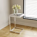 Modern Side Table with Marble Top Silver Frame Vase of White Tulips Book by Window