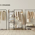 Clothes Hanging on Racks in Minimalist Fashion Store Display with Neutral Tones and Accessories