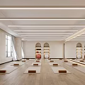 Spacious Yoga Studio With Neatly Arranged Yoga Mats Wooden Floors White Walls and Strip Lights