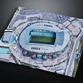 Aerial View Of Large Modern Football Stadium With Green Pitch And Surrounding Roads