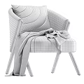 Modern Neutral Upholstered Armchair With Wooden Arms And Gray Throw Blanket