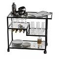 Stylish Black Serving Cart With Glass Shelves Plates Glasses And Magazine