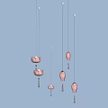 Pink Lotus Shaped Multiple Hanging Pendant Lights Against Light Blue Background