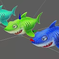 Three Colorful Cartoon Style Toy Shark Figures With Big Eyes And Smiling Mouth