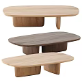 Three Modern Oval Shaped Wooden Coffee Tables In Different Natural Wood Tones