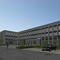 Modern Office Building Exterior With Large Glass Windows Green Trees Lawns Pedestrians And Parked Car