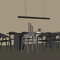 Modern Dining Table And Black Chairs Set With Hanging Pendant Light And Decorative Items