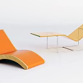 Modern Orange Lounge Chairs With Wooden And Metal Frames And Glass Top Table