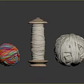 Colorful And White Yarn Balls With Wooden Spool On Black Surface