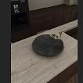 Modern Kitchen Countertop With Gray Ceramic Bowl And Green Foliage