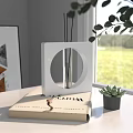 Elegant Reed Diffuser Aromatherapy Product On Book For Modern Home Decor With Green Plant