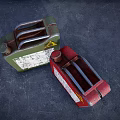 Green And Red Worn Fuel Cans With Warning Symbols And Labels