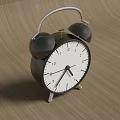 Black Double Bell Alarm Clock With White Dial Placed On Wooden Surface 3d model