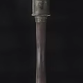 Ancient Weapon With Intricate Wooden Handle And Decorative Metal Accents