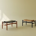 Minimalist Sofa Stools With Wooden Frame And Black Brown Cushions On Light Background