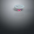 White Circular Disc With Pink Base On Gray Background And Reflective Surface