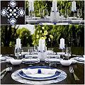 Blue And White Dinnerware Set With Plates Glasses Napkins Candles And Flowers On Dining Table