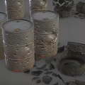 Rusted Metal Barrels With Intact And Broken Parts And Scattered Debris