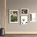 Elegant Wall Art Display With Framed Paintings And Branch Vase Decor