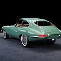 Vintage Green Sports Car With Brown Interior And White Wheels Design