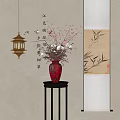 Red Vase With Blooming Flowers On Black Stand Near Chinese Calligraphy And Bamboo Painting