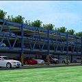 Multilevel Parking Lot With Blue Structure Various Colored Cars Green Trees And Grassland