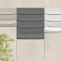 Fabric Curtains in Different Gray Tones Displayed on Beige Wall with Green Plant Accent