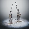 Two Industrial Cranes With Tall Metal Structures And Mechanical Arms On Platform
