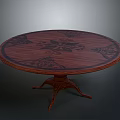 Classic Wooden Round Table With Patterned Tabletop And Intricate Carved Legs