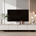 Modern White TV Stand In Living Room With Wall Mounted TV Green Plant And Decorations