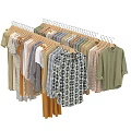 Assorted Clothes Hanging On Wooden Racks With Various Patterns Colors And Styles Including Shirts Dresses