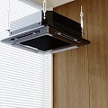Black Ceiling Mounted Air Conditioner Fan In Room With Wooden Wall And White Window Blinds
