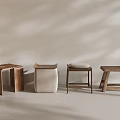 Modern Stools With Various Designs Wooden And Fabric Seats On Light Background