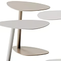 Three Modern Light Toned Side Tables With Slim Legs And Minimalist Design