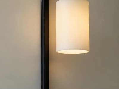 Modern Wall Sconce With Black Frame And White Cylindrical Shade Emitting Warm Light 3d model