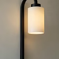Modern Wall Sconce With Black Frame And White Cylindrical Shade Emitting Warm Light 3d model