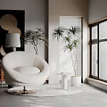 White Round Accent Chair in Modern Minimalist Space with Green Plants and Natural Light