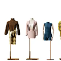 Mannequins Display Various Stylish Outfits On Gold Display Stands In Clothing Showroom